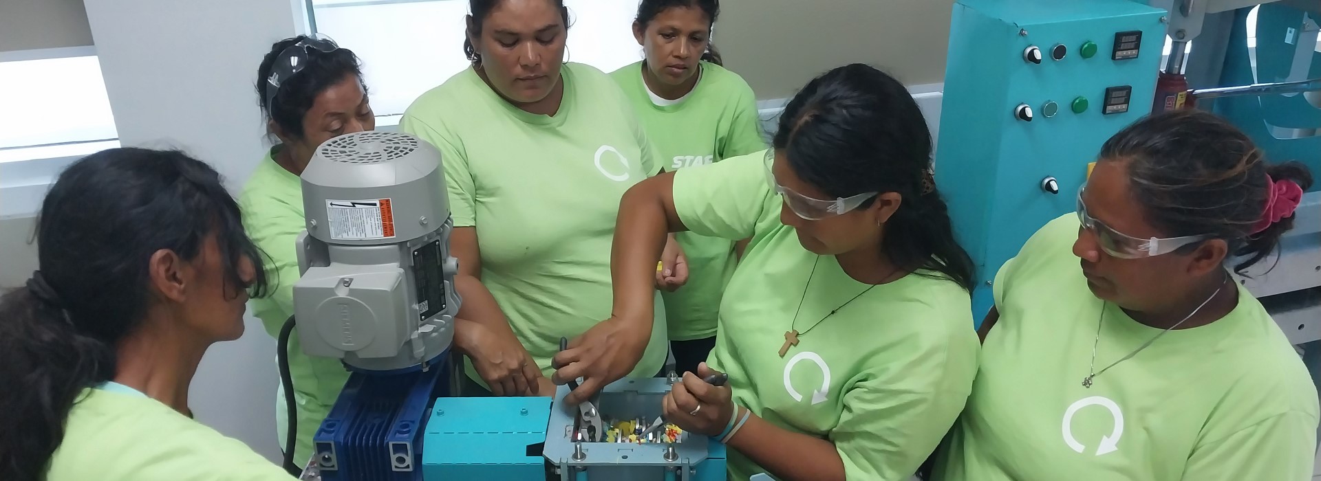 Women in Honduras operating a machine