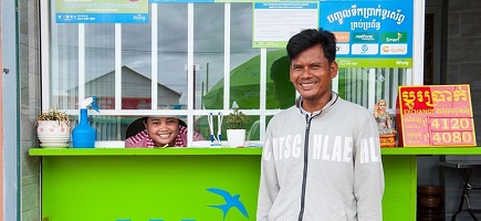 Sam Vong Khemrey (Wing agent) and Ou Sea (beneficiary) during the disbursement of the COVID cash transfer.